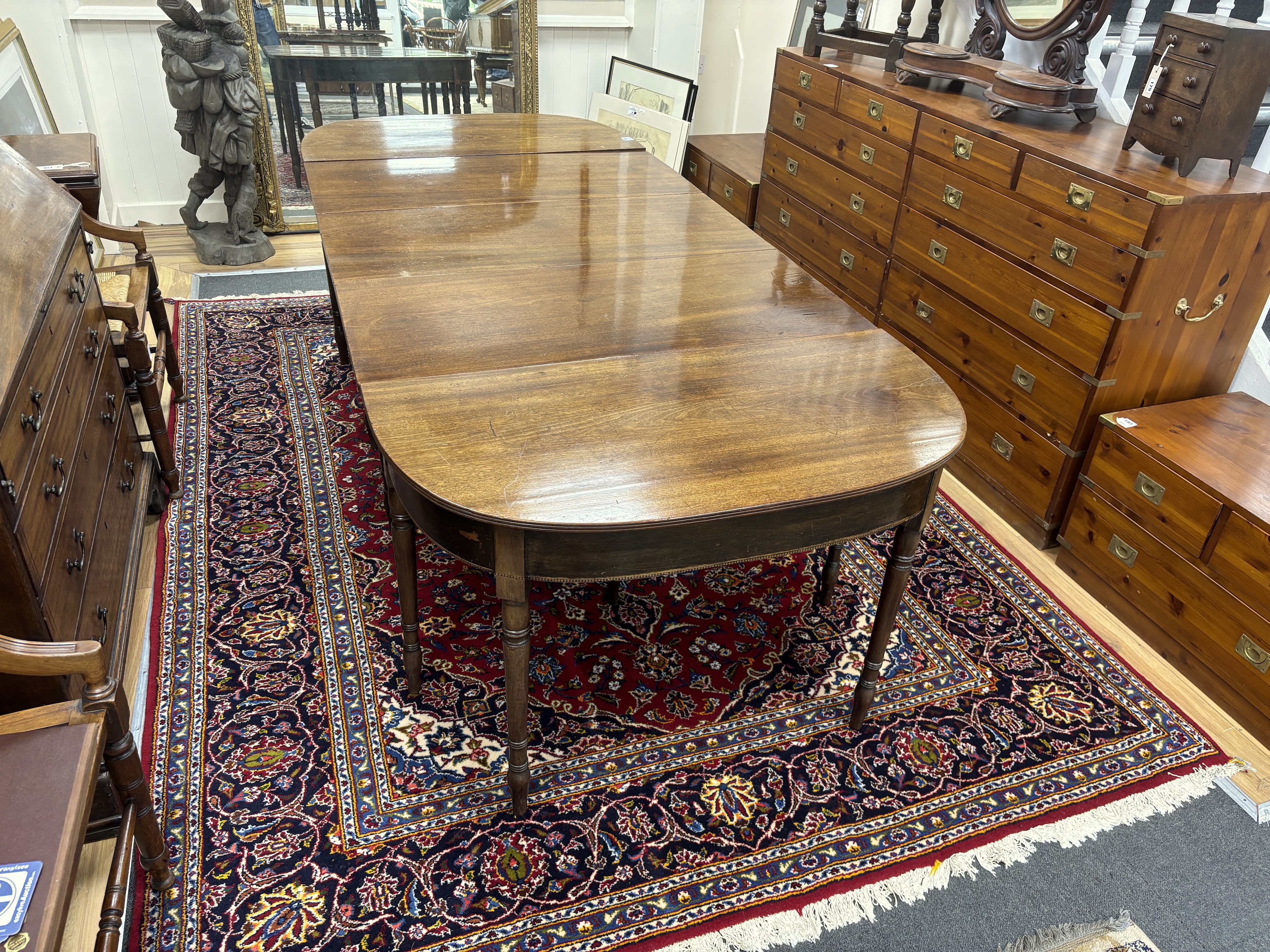 A Regency mahogany D end extending dining table, 257cm extended, width 109cm, height 70cm